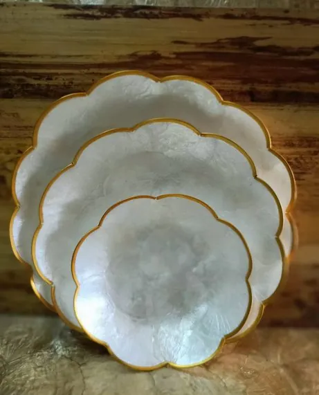 Capiz scallop plates with gold rims