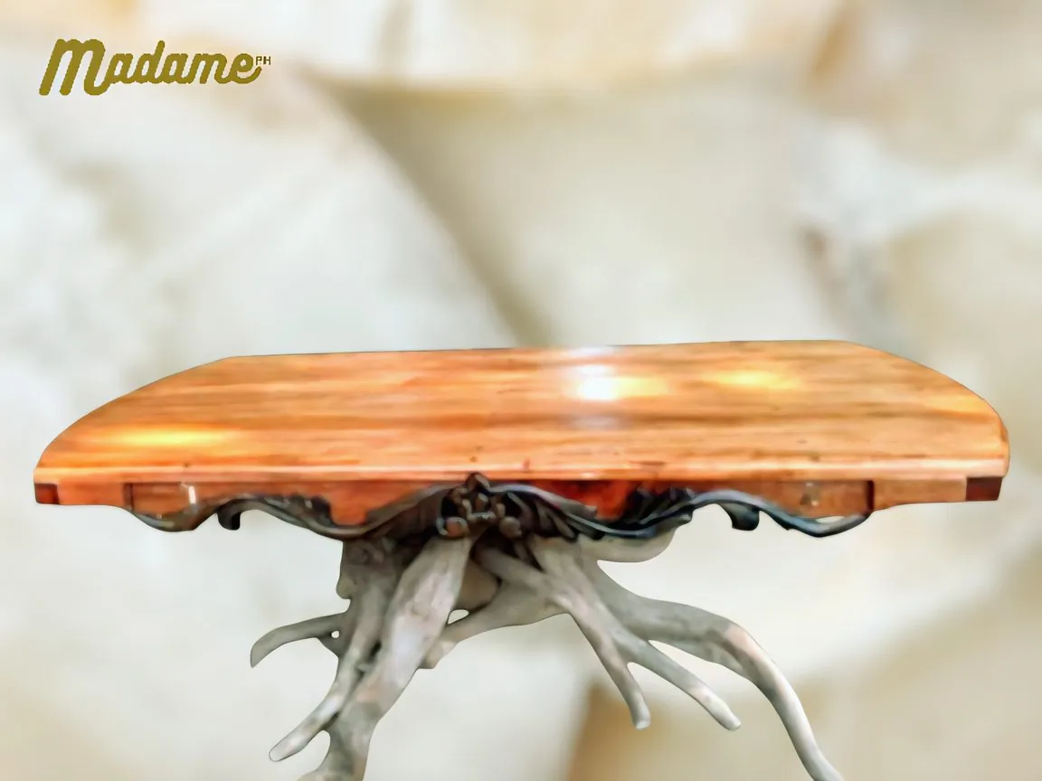 Sinag Mesa hardwood table on a root-inspired base